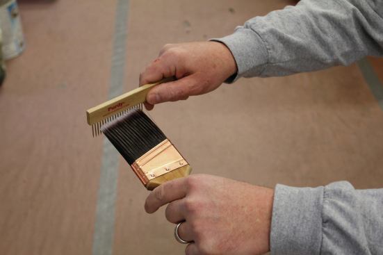 An inexpensive brush comb straightens a brush's bristles after cleaning.