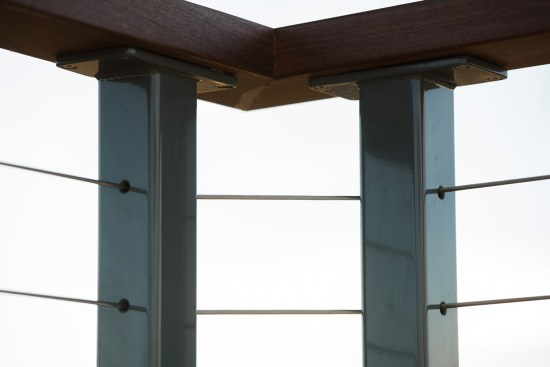 The author prefers double corner posts, which offer a more gradual bend for the cable and a more secure corner attachment for the ipe top rail.
