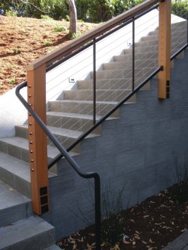 To gain a little extra square footage, fascia-mounted wood posts can be lag-screwed or through-bolted to the framing. Or fascia-mount brackets for wood posts can be used.