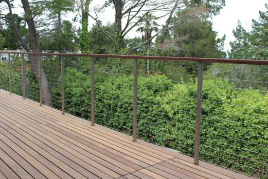 Salas often combines wood top rails with aluminum- or steel-framed rail systems. To maintain the cable spacing, posts and intermediate pickets should be no more than 3 feet apart.