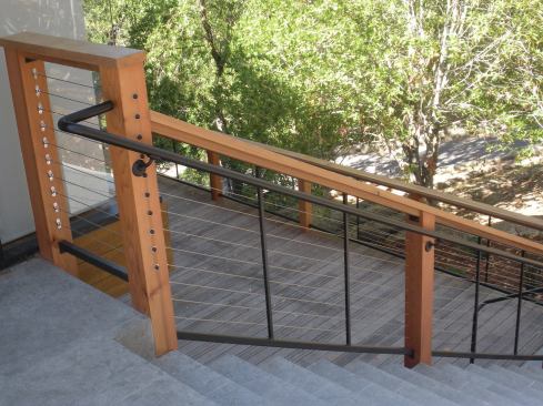 Surface-mount fittings are useful when access to the back of a post is limited or where the cable terminates at a wall.