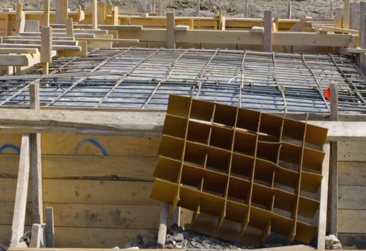 We isolated the slab from the soil using carton forms.