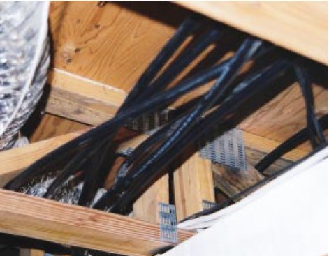 The 1/2-inch PEX-AL-PEX tubing used in this retrofit hydronic system can be snaked through framing cavities much like electrical cable.