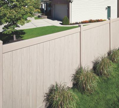 Once available only in white, high-end vinyl fencing now comes in a wide range of colors and wood-grain textures. 