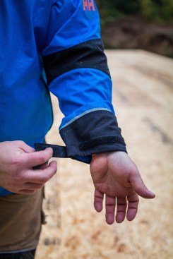 Hook and loop tabs at the wrists are adjustable and can be cinched down to keep water out of the sleeve. 