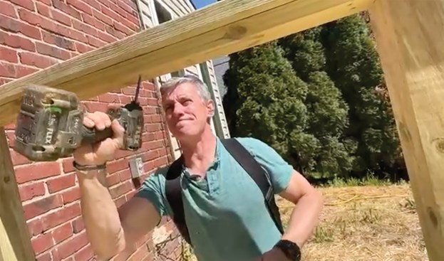 Between each guard post, he installs a 2x4 subrail (B) to lock the posts firmly in position. This is required to resist the tension the cables transfer to the posts.