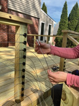 A flared, unidirectional “pull lock” is slipped on the end of the cable.