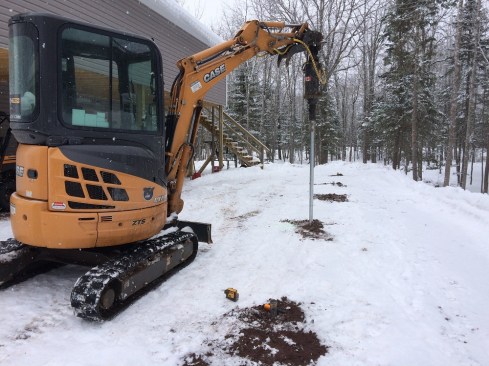 Most of the author's decks are supported by helical pile foundations, which can be installed after frost sets in if necessary.