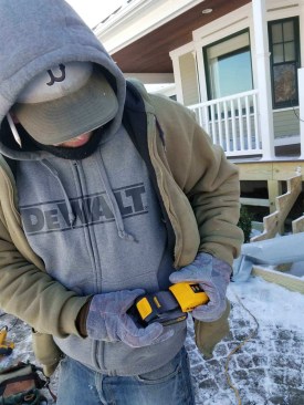 Some of the crew wear heated jackets, which plug into a standard DeWalt 20v battery pack. The jackets come with an LED controller with three heat settings.