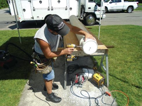 To lower the height of the column's decorative trim rings, the author screwed plugs made from a double layer of 3/4-inch-thick PVC into the the tops of the columns. 