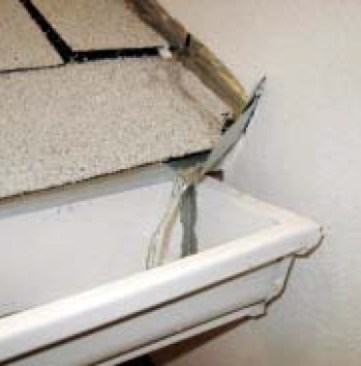 The solution is to divert the water away from the wall using kickouts — small pieces of sheet metal placed at the end of the step flashing and sealed to the wall and roof sheathings with some peel-andstick flexible flashing.