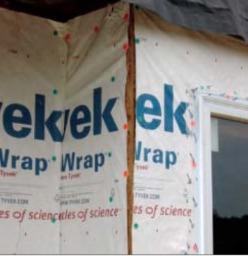 Incomplete coverage. Water-resistive barriers must be installed correctly. The rips and gaps in the WRB shown here will allow any water blowing through to leak into the wall at the corners. The housewrap should be overlapped approximately 12 inches at the corners and sealed with an acrylicbacked tape. Note that the tape used for the window flashing is not an approved flashing material. It will probably fail as a result of differential movement.