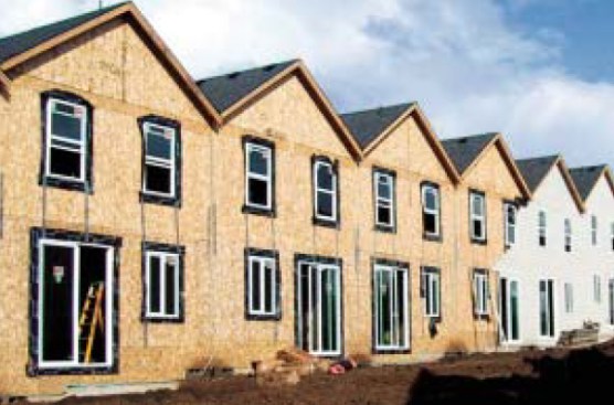 Whenever a valley runs into a horizontal plane, the water flowing down that valley will become trapped. If there’s enough water at one time (or it turns to snow), it’s likely to back up under the shingles and flashing. A whole series of horizontal valleys has been created between these condo units.