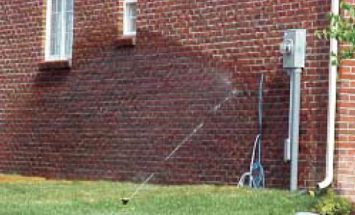 The homeowner factor. Imagine the force of this sprinkler and the amount of water that is pouring into this wall. This is a perfect example of why redundancy is so important. The only way to avoid problems caused by the homeowner irrigating this wall is to make sure a WRB behind the brick is impeccably detailed, the drainage cavity and weep holes remain open, well-draining backfill is put in, and good perimeter drainage is installed.