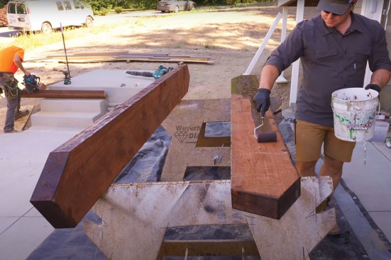 A roller makes quick work of applying wood preservative on all the surfaces.
