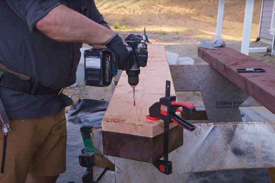Clamped to each stringer, the template guided drilling of the pilot holes for the mounting brackets.