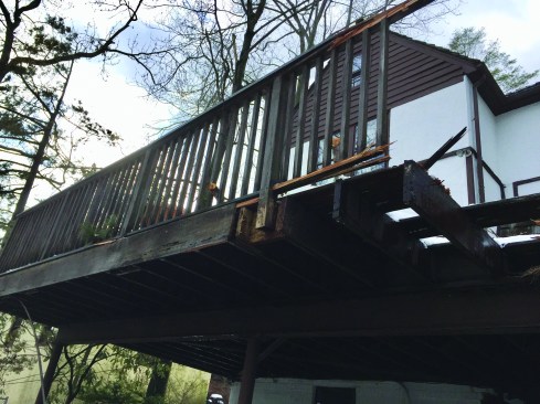 The original red-cedar deck sustained damage when a tree fell on it during a windstorm, but it was due for replacement anyway, thanks to sketchy ledger connection details and extensive rot.