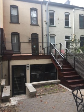 The new rooftop deck creates a comfortable backyard outdoor living space, a valuable commodity in urban New Jersey.