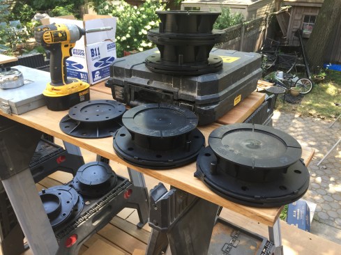 To account for the slope of the roof, Bison Versadjust pedestals are available in different sizes, each with a range of adjustment. They also have angled bases that can be rotated to provide a perfectly flat surface to support the deck panels.