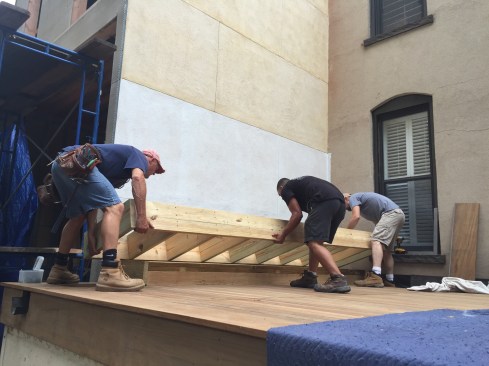 The bench frame was assembled from PT lumber. No fasteners were used to anchor the bench to wall behind it, which belonged to the neighboring brownstone residence.