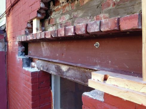 The outer steel channel, which was shorter than the inner channel, was cantilevered above the bricked-over window and supported by the Lally column set under the inner channel.