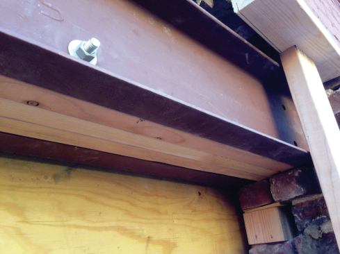 On the right side of the opening, the beam was blocked down to the existing brick.