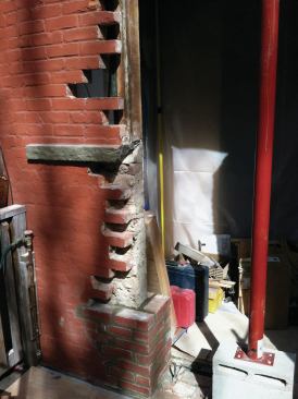 After the old door was removed, the temporary Lally column was set inside the new opening.