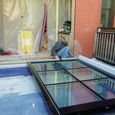 The fixed panel had been shipped with the jamb still attached, so the next step was to add the other jamb and attach the sill to the jambs through the bottom using screws provided by Zola.