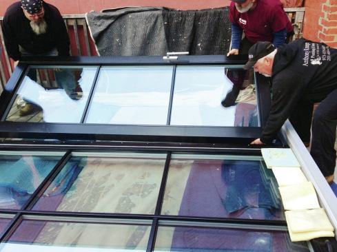 The 300-pound active panel was lowered straight down over the frame.