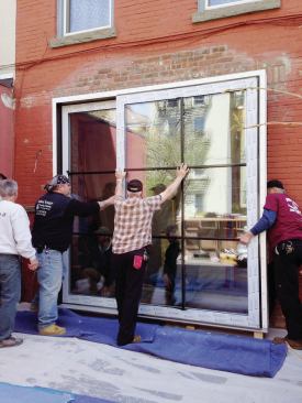 It took a lot of lifting and sliding to get the door partly into the opening.