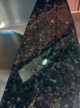 Failed reinforcing rods cause cracks like the one in this Uba Tuba granite countertop.(Return to article)