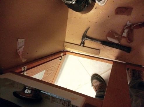 The face of a framed cabinet pops off easily once the screws  holding adjacent cabinets together are removed.
