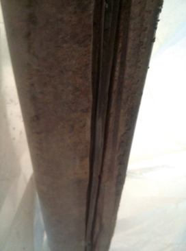To remove the rod, grind away the adhesive on both sides wherever the rod is rusted.