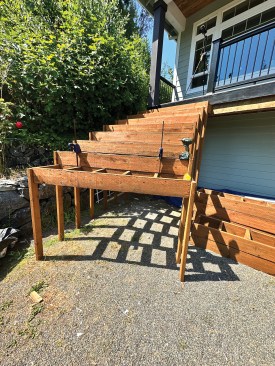 After each box was in place, I screwed a pair of temporary 2x4 support posts to either side that extended all the way to the ground.