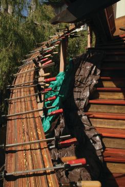 Strips of redwood were laminated to create the stair's handrail. Bender Board, a landscaping product, acted as a form.