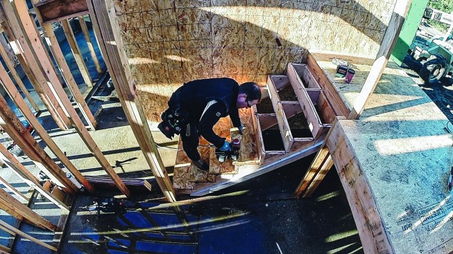 Then he nails the tread off to the stringers.