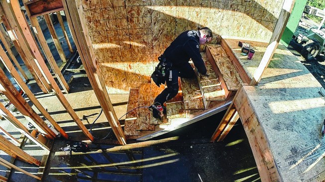 The riser-to-tread connection needs to be precise and strong, as it is the most likely place for a stair to squeak. After securing the treads in place, he is careful to mark the overhang.