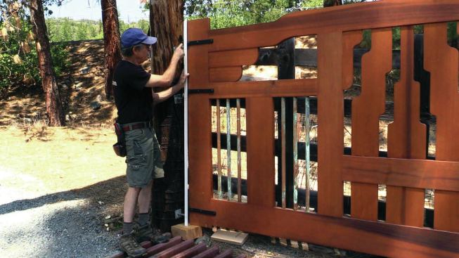 The author installed the hinges on the gate first, then marked their locations on a story pole.