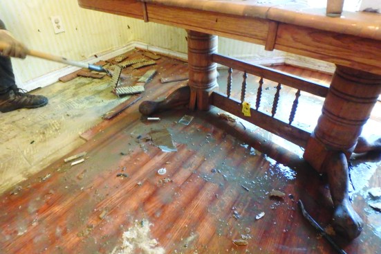 All the interior materials and finishes were ruined, including the wood flooring shown here.
