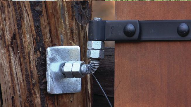 Running the all-thread long and using two sets of jamb nuts made it possible to plumb the J-bend for each hinge.