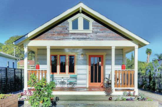 Los Angeles-based ReInhabit buys period homes and restores them, using a mix of original, new, and salvaged materials. The front porch of this 1925 bungalow  is floored with redwood original to a music studio, and the gable is sided with wine-barrel planks. The bandsawn balusters are new, made by ReInhabit from redwood.