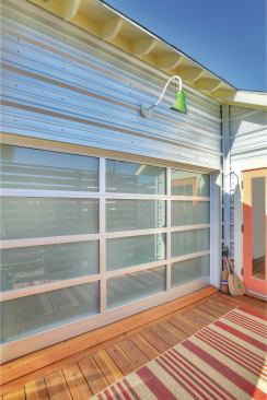 The salvaged door closes easily, with the push of a button.