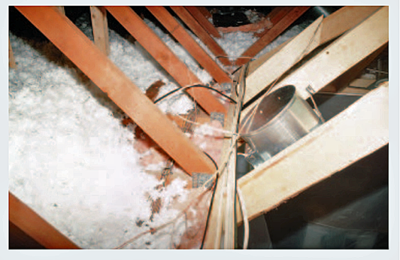 Figure 3. Cutting the bottom chord of the truss a little beyond the metal plate allowed the original truss web to provide some support for the drywall ceiling.