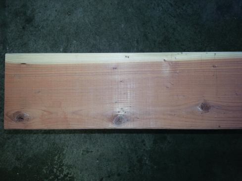 Though only a sliver of sap wood can be seen on this face of redwood lumber, it still exceeds ten percent, and therefore is not considered decay resistant.