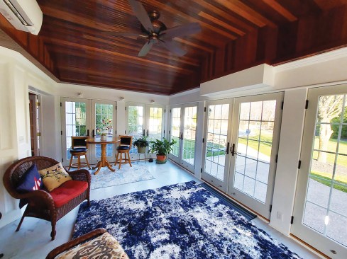In a room with a higher ceiling, a TV can be mounted to a vertical drop-down power actuator that retracts the TV into the ceiling (if there is enough clearance above) or into an enclosure mounted on the wall. 