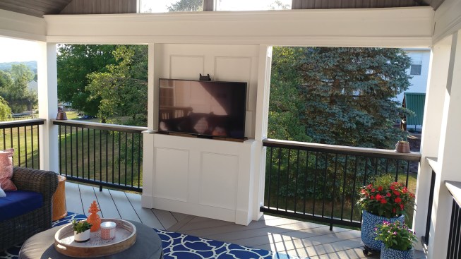 These lifts (a good source is tvliftcabinet.com) allow the TV to drop down out of sight when not being viewed, with the cabinet lid closing over it automatically.
