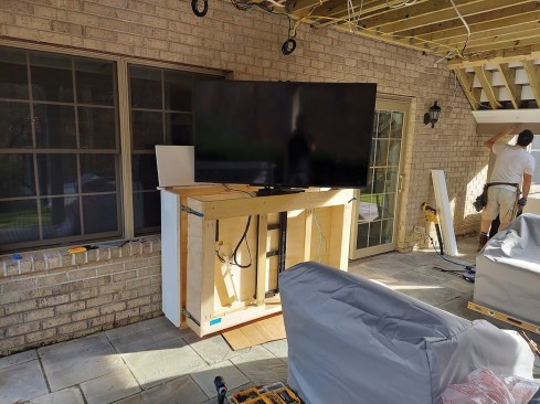 If the TV needs to be able to rotate, the lift can be installed in a cabinet with a pull-out drawer mounted with heavy-duty slides that allow the whole assembly to extend out away from the wall.