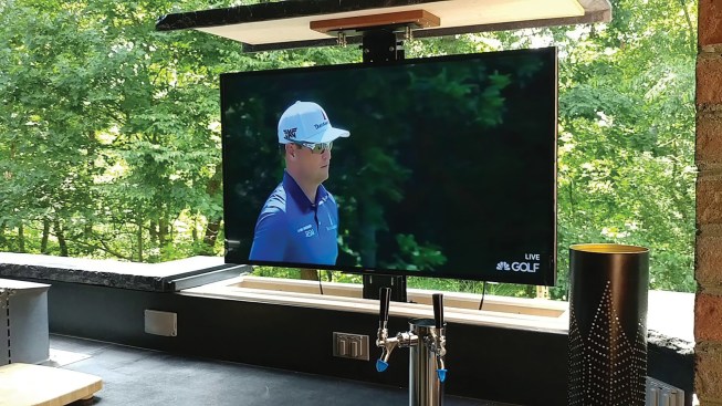 When the TV is retracted, the lid covers the recess where the TV is stored, and any water entering at the ends is channeled away by the two short gutters at each end. The lid lifts up and out of the way when the mechanism raises the TV into viewing position, as shown above.