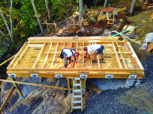 Deck brackets are bolted to the floor frame ...