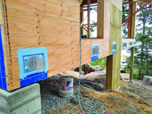 The brackets and sheathing edges are sealed with Henry Air-Bloc LF.